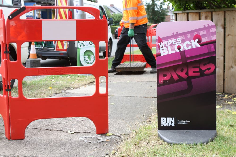 Roadworks with a Bin the Wipe sign