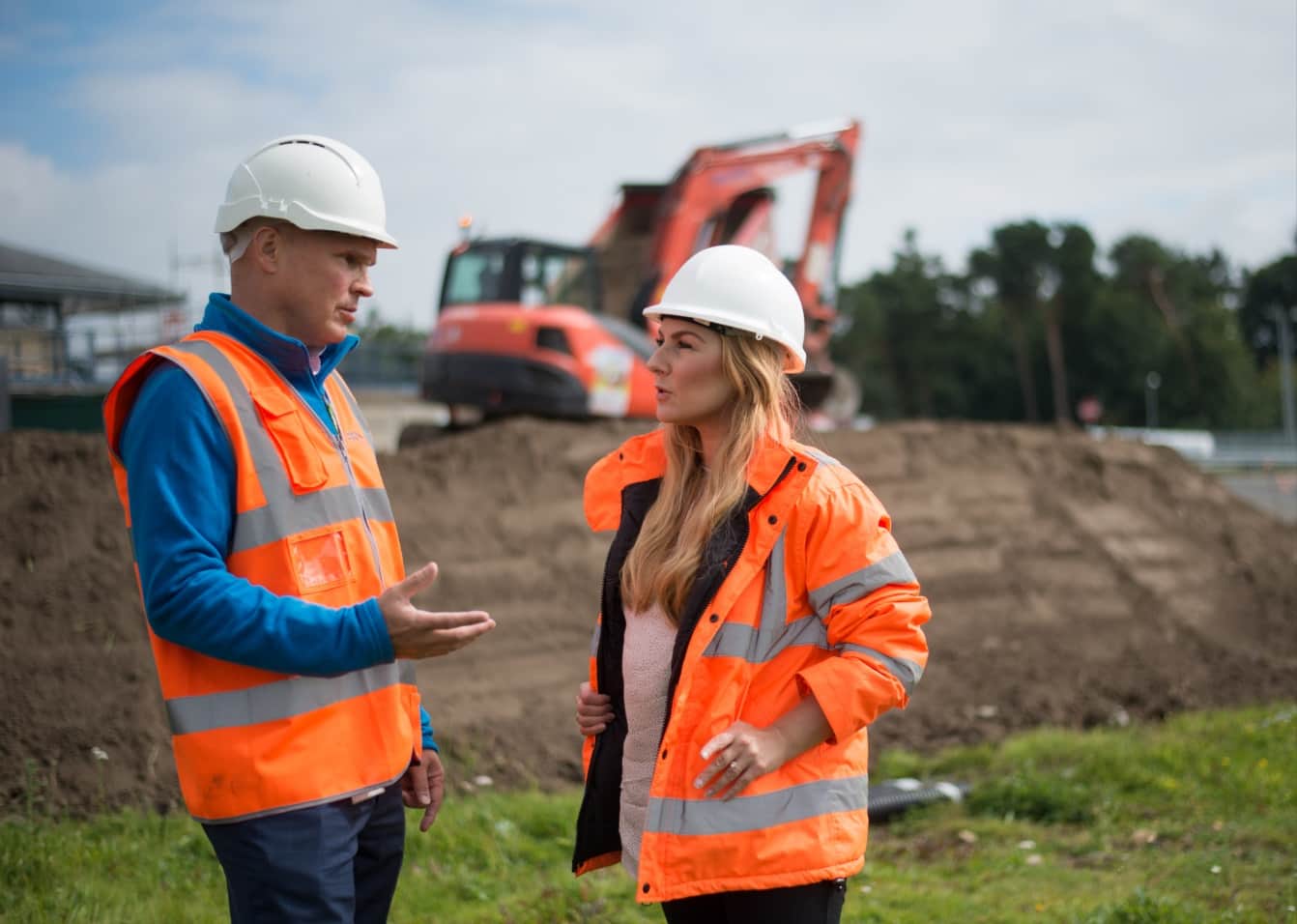 Northumbrian Water employees talking on building site