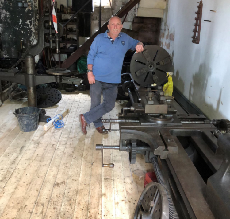 volunteer David Smart inside the beam engine house.png