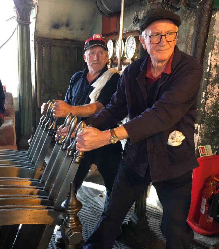 David Smart and another volunteer George Beautyman operating the Victorian beam engine.png