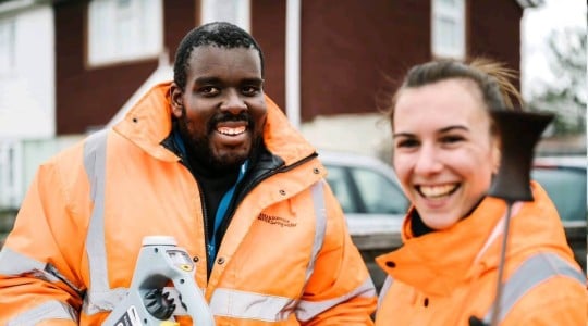 Two Northumbrian Water leakage technicians man and woman in high-vis